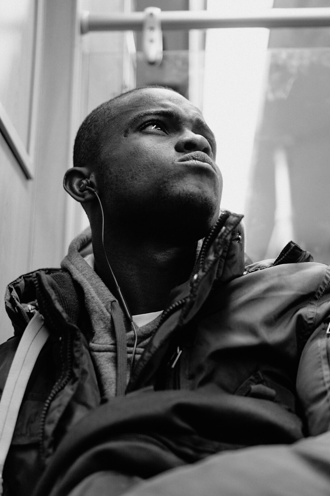Studio portrait of a Polish man in his 30s wearing headphones