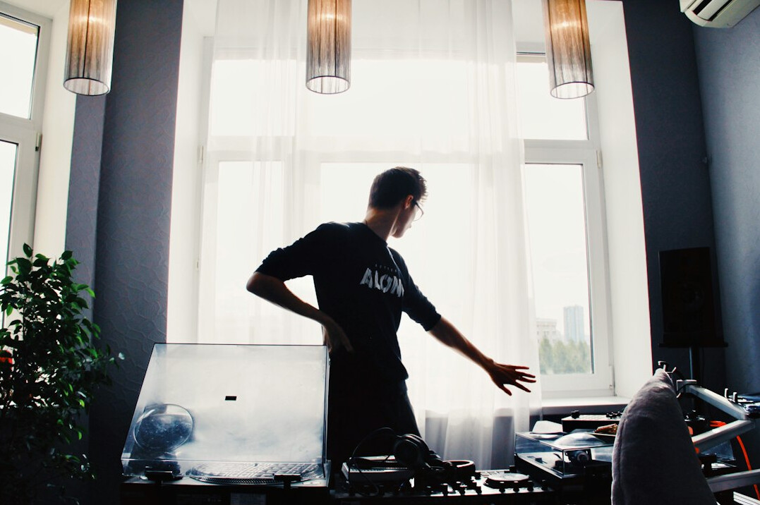 Polish man working on multi-track audio editing software
